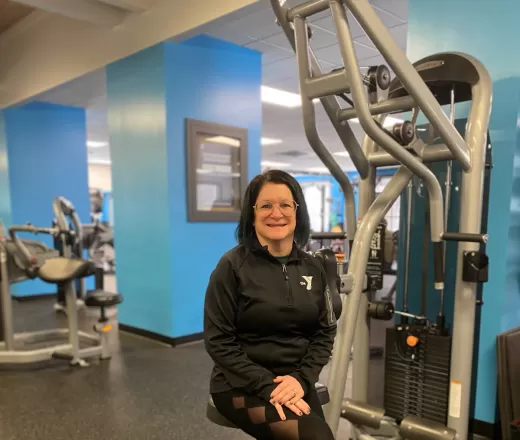 pam sitting on weight machine