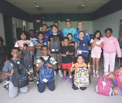 group of kids with backpacks