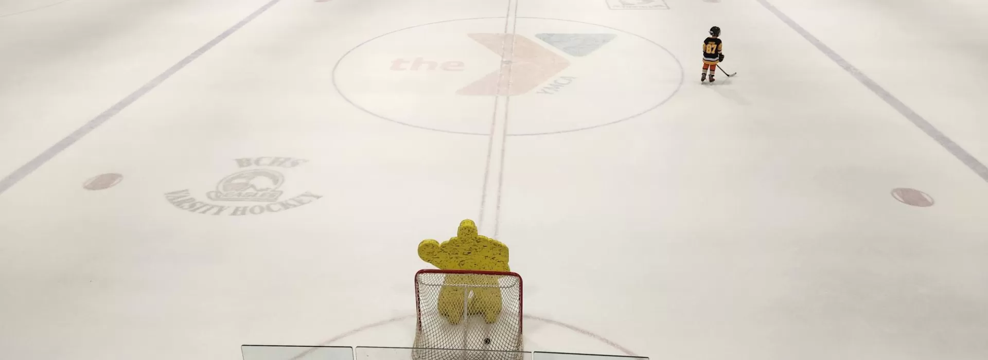 kids skating on ice playing hockey