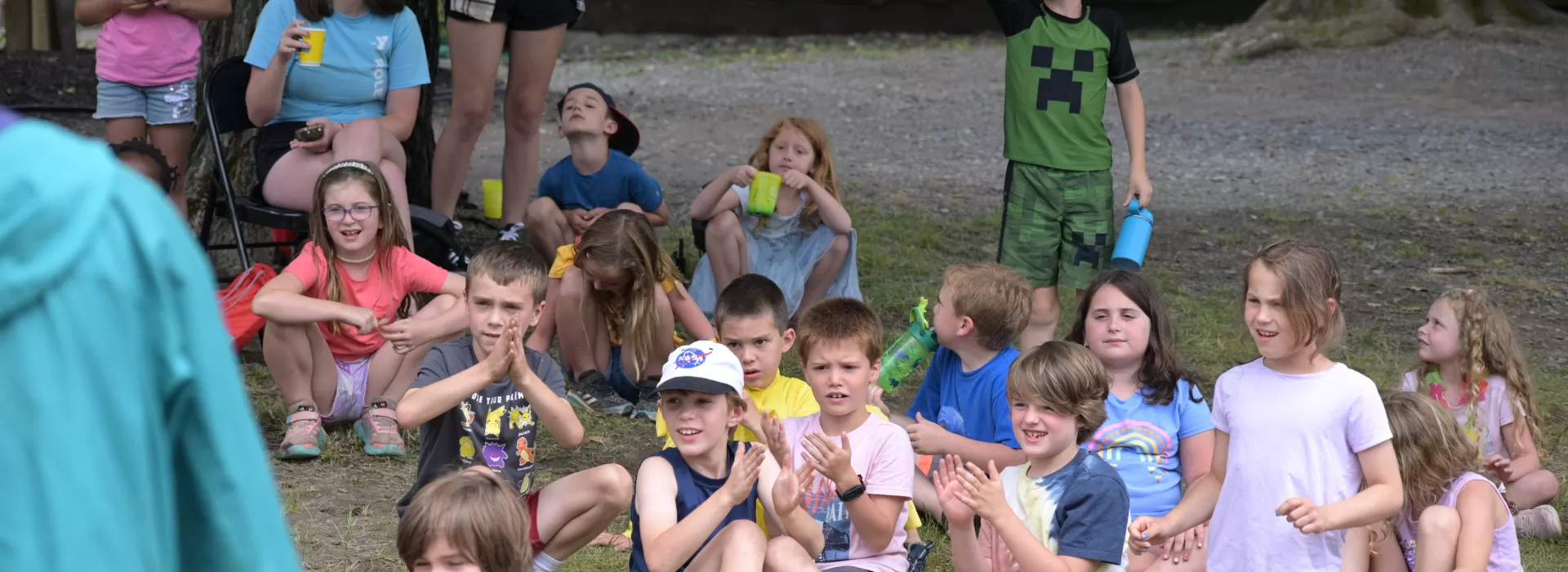 Group of kids sitting outside